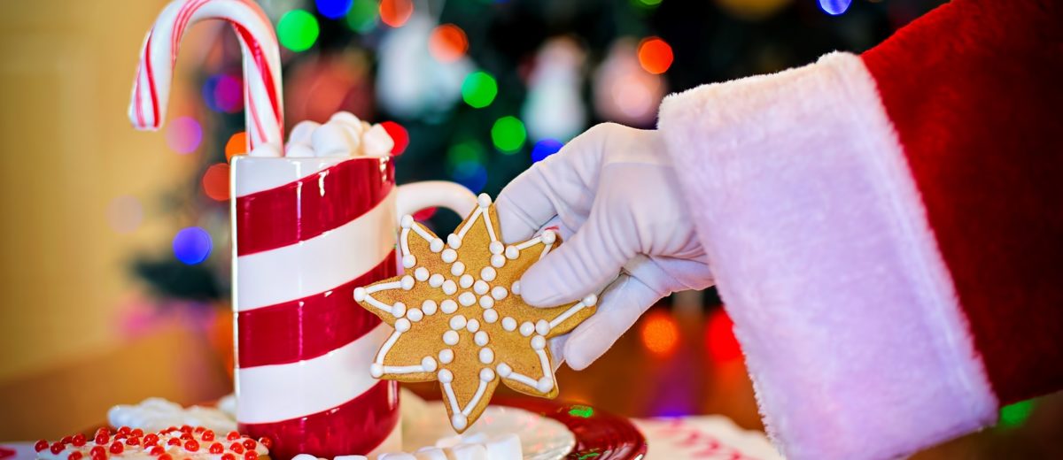 santa claus reaching for a cookie